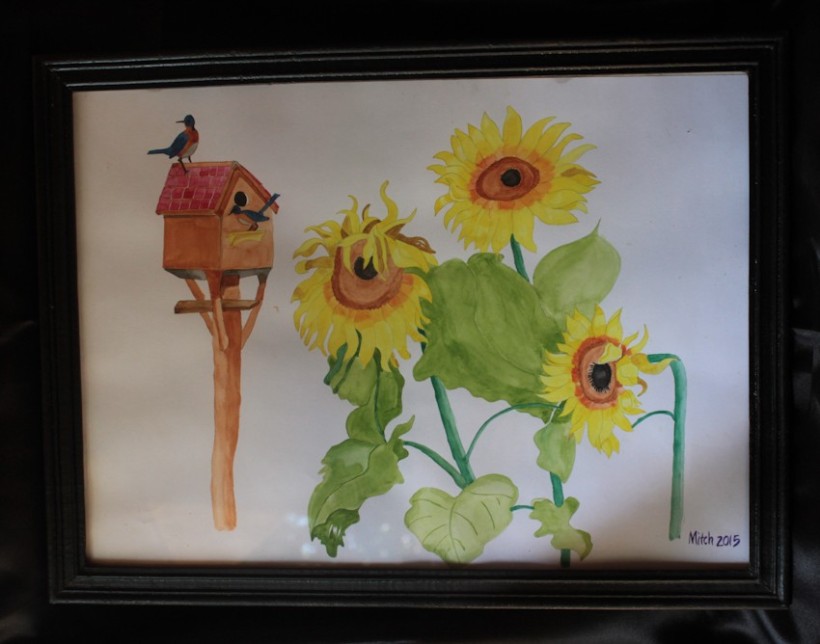 Painting of birds on sunflowers.